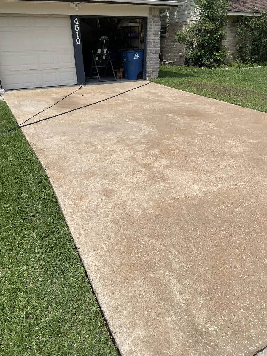 Driveway after power washing — clean concrete