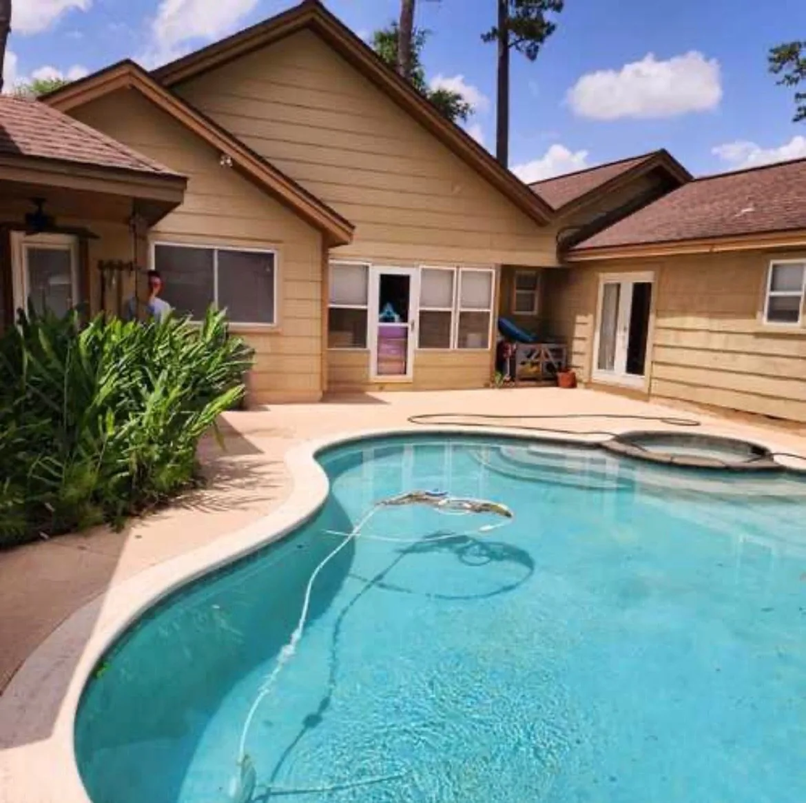 Patio and pool deck after pressure washing — clean concrete
