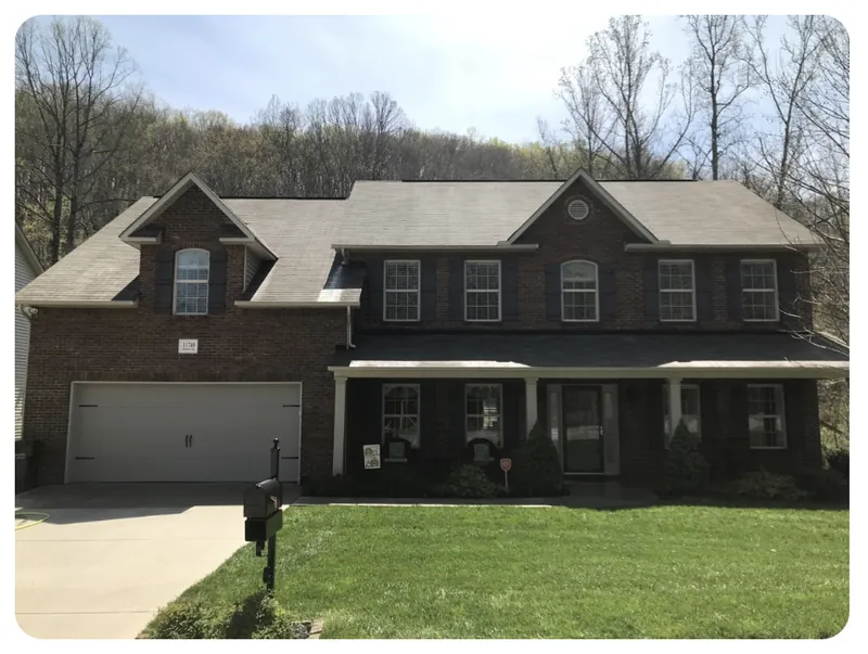 Same house roof clean and restored after soft wash treatment