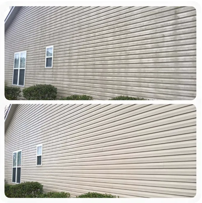 Large house side wall with heavy mold and mildew stains before soft washing
